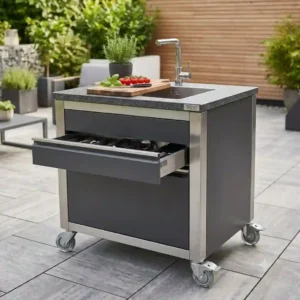 A mobile modular arbeitsfläche außenküche unit with lockable wheels on a patio
